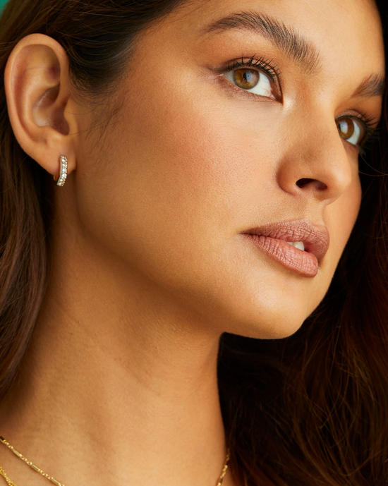 Davie Huggie Hoop Earring in White Topaz | Sterling Silver + 18K Gold